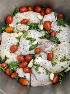 Roast chicken with garlic, basil and tomato